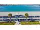 Waterfront building, aerial view, showing parking and landscaping at 250 126Th Ave # 206, Treasure Island, FL 33706