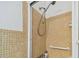 Small bathroom with shower, tiled walls and a grab bar at 250 126Th Ave # 206, Treasure Island, FL 33706