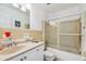 Clean bathroom with a shower/tub combo and updated vanity at 250 126Th Ave # 206, Treasure Island, FL 33706