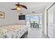 Bedroom with water view, ceiling fan, and a walk-in closet at 250 126Th Ave # 206, Treasure Island, FL 33706