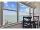 Enjoy water views from this waterfront dining area with table and chairs at 250 126Th Ave # 206, Treasure Island, FL 33706