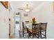 Dining area features a round table, chairs and decorative plants at 250 126Th Ave # 206, Treasure Island, FL 33706