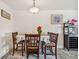 Dining room with a table for four and a view into living area at 250 126Th Ave # 206, Treasure Island, FL 33706