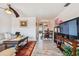 Bright living room with tiled floors, comfortable seating, and a view to dining area at 250 126Th Ave # 206, Treasure Island, FL 33706