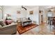 Living room boasts light walls, comfy seating, and a wood-look floor at 250 126Th Ave # 206, Treasure Island, FL 33706
