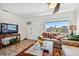 Living room with tiled floors, seating area, and view to the outside at 250 126Th Ave # 206, Treasure Island, FL 33706
