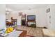 Living room with a view of the dining area and a flat screen tv at 250 126Th Ave # 206, Treasure Island, FL 33706
