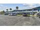 Parking lot in front of a light-blue building at 250 126Th Ave # 206, Treasure Island, FL 33706