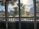 Screened in balcony with view of parking, landscaping and other community buildings at 2593 Countryside Blvd # 7213, Clearwater, FL 33761
