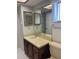 Bathroom with double vanity and updated fixtures at 2593 Countryside Blvd # 7213, Clearwater, FL 33761