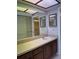 Bathroom with double vanity and large mirror at 2593 Countryside Blvd # 7213, Clearwater, FL 33761