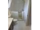 Bathroom with walk-in tub, tile floor, toilet and small vanity at 2593 Countryside Blvd # 7213, Clearwater, FL 33761