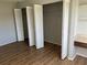 Bedroom features built-in shelving and bi-fold closet doors at 2593 Countryside Blvd # 7213, Clearwater, FL 33761