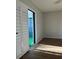 Bright bedroom with wood floors and sliding door to balcony at 2593 Countryside Blvd # 7213, Clearwater, FL 33761