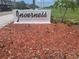 Welcoming Inverness community sign surrounded by lush, well-maintained landscaping at 2593 Countryside Blvd # 7213, Clearwater, FL 33761