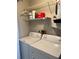 Laundry area with washer and dryer and shelving at 2593 Countryside Blvd # 7213, Clearwater, FL 33761
