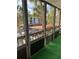 View from screened balcony showcases partial water view and parking lot at 2593 Countryside Blvd # 7213, Clearwater, FL 33761