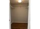 Large walk-in closet with wire shelving and wood flooring at 2593 Countryside Blvd # 7213, Clearwater, FL 33761