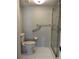 Bathroom with toilet, shower, grab bars, and linen closet at 2593 Countryside Blvd # 7213, Clearwater, FL 33761