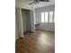 Bedroom with wood-look floors, ceiling fan and large closet at 2593 Countryside Blvd # 7213, Clearwater, FL 33761
