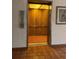 Simple elevator with wood-paneled interior at 2593 Countryside Blvd # 7213, Clearwater, FL 33761