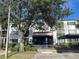 Building entrance with landscaping and parking at 2593 Countryside Blvd # 7213, Clearwater, FL 33761