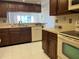 Updated kitchen with wood cabinets, tile floors, and stainless steel appliances at 2593 Countryside Blvd # 7213, Clearwater, FL 33761