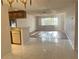 Open kitchen with light cabinetry, and breakfast bar at 2593 Countryside Blvd # 7213, Clearwater, FL 33761