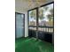Screened balcony with artificial turf and view of community at 2593 Countryside Blvd # 7213, Clearwater, FL 33761
