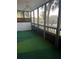 Screened porch with artificial turf and ceiling fan at 2593 Countryside Blvd # 7213, Clearwater, FL 33761