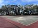 Two tennis courts with red surface, ready for a game at 2593 Countryside Blvd # 7213, Clearwater, FL 33761