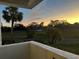 Sunset view from balcony overlooking field at 2593 Countryside Blvd # 7213, Clearwater, FL 33761