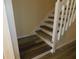 White staircase with wood-look vinyl treads at 262 Countryside Key Blvd, Oldsmar, FL 34677