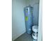 Interior view of a water heater and paint cans in a storage closet at 262 Countryside Key Blvd, Oldsmar, FL 34677