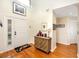 Bright entryway with hardwood floors, decorative console table, and coat closet at 3003 Longbrooke Way, Clearwater, FL 33760