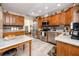 Well-equipped kitchen with stainless steel appliances and ample counter space at 3003 Longbrooke Way, Clearwater, FL 33760