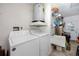 Laundry room with washer, dryer, and extra storage at 3003 Longbrooke Way, Clearwater, FL 33760