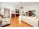 Living room with hardwood floors, built-in shelving, and a fireplace at 3003 Longbrooke Way, Clearwater, FL 33760