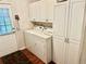 Laundry room with washer, dryer, and extra storage at 34612 Pine N Dr, Pinellas Park, FL 33781