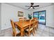 Charming dining room with wood table and view of the pool at 391 Meravan Ct, Palm Harbor, FL 34683