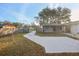 Large backyard with concrete patio and fenced area at 3911 King Dr, Brandon, FL 33511