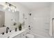 Clean bathroom with white vanity, tub shower combo, and modern fixtures at 3911 King Dr, Brandon, FL 33511