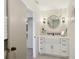 Modern bathroom with a farmhouse sink and round mirror at 3911 King Dr, Brandon, FL 33511