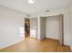 Bright bedroom with wood flooring and a large closet at 3911 King Dr, Brandon, FL 33511