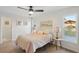 Light and airy bedroom with double bed, bedside table, and ample closet space at 3911 King Dr, Brandon, FL 33511
