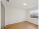 Spacious bedroom with light wood floors and a window at 3911 King Dr, Brandon, FL 33511