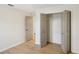 Bright bedroom with light wood flooring and a spacious closet at 3911 King Dr, Brandon, FL 33511