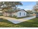 Side view of the house with a walkway and landscaping at 3911 King Dr, Brandon, FL 33511