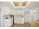 Modern kitchen with white cabinets, quartz countertops, and stainless steel appliances at 3911 King Dr, Brandon, FL 33511