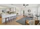 Open concept kitchen with white cabinets and breakfast bar at 3911 King Dr, Brandon, FL 33511